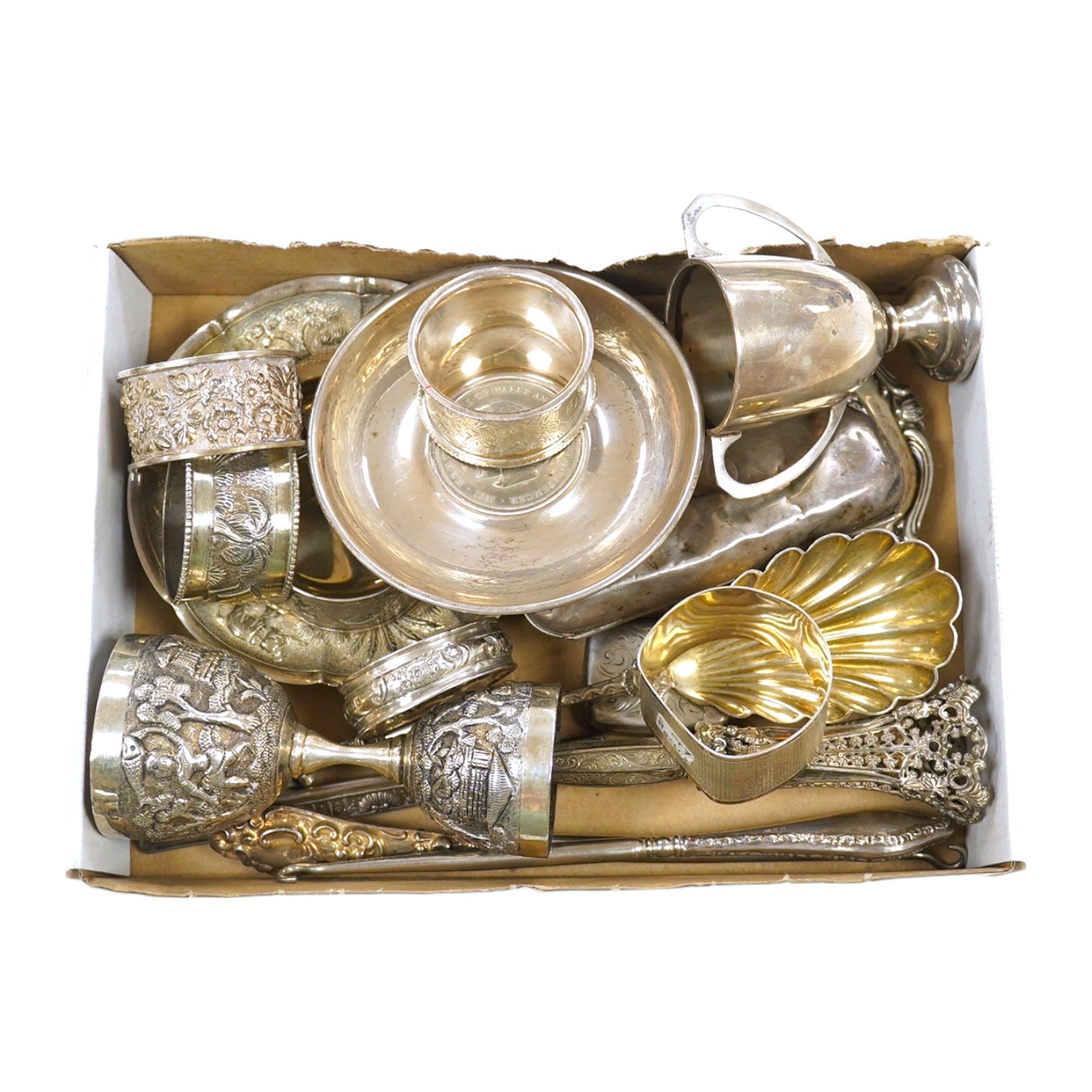 A group of assorted small silver and white metal wares including a white metal posy holder and an Indian white metal measuring cup, 9.5oz of hallmarked silver. Condition - fair to good.